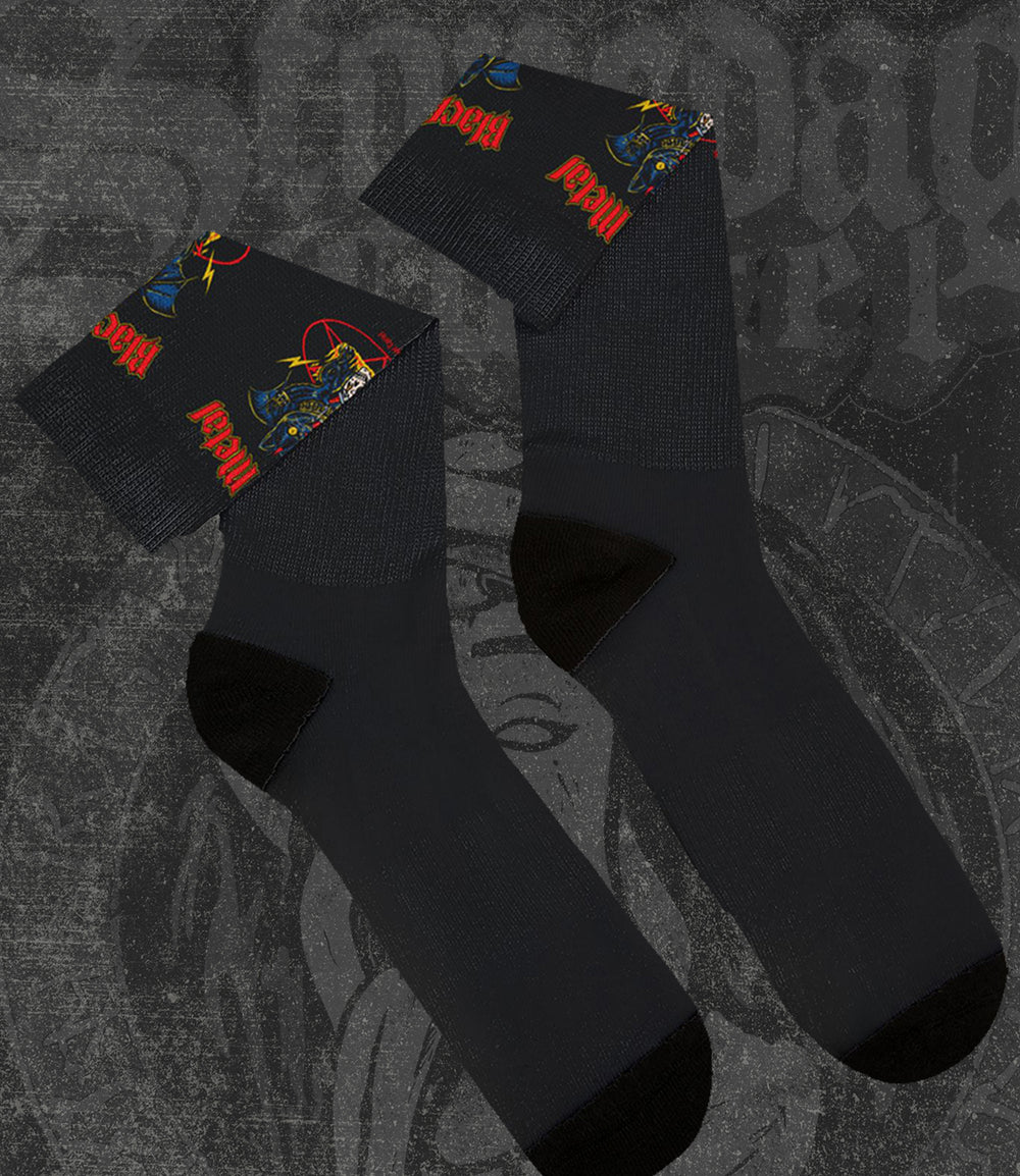 Black socks with colorful designs on a textured background